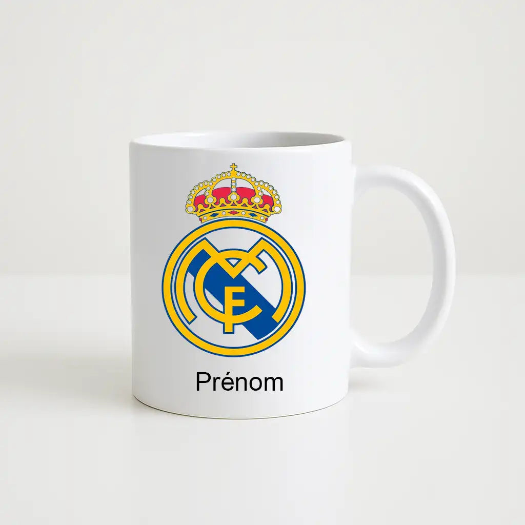 Mug blanc de 330 ml avec le logo du club Real Madrid , accompagné de l’inscription "Prénom" personnalisable en dessous.