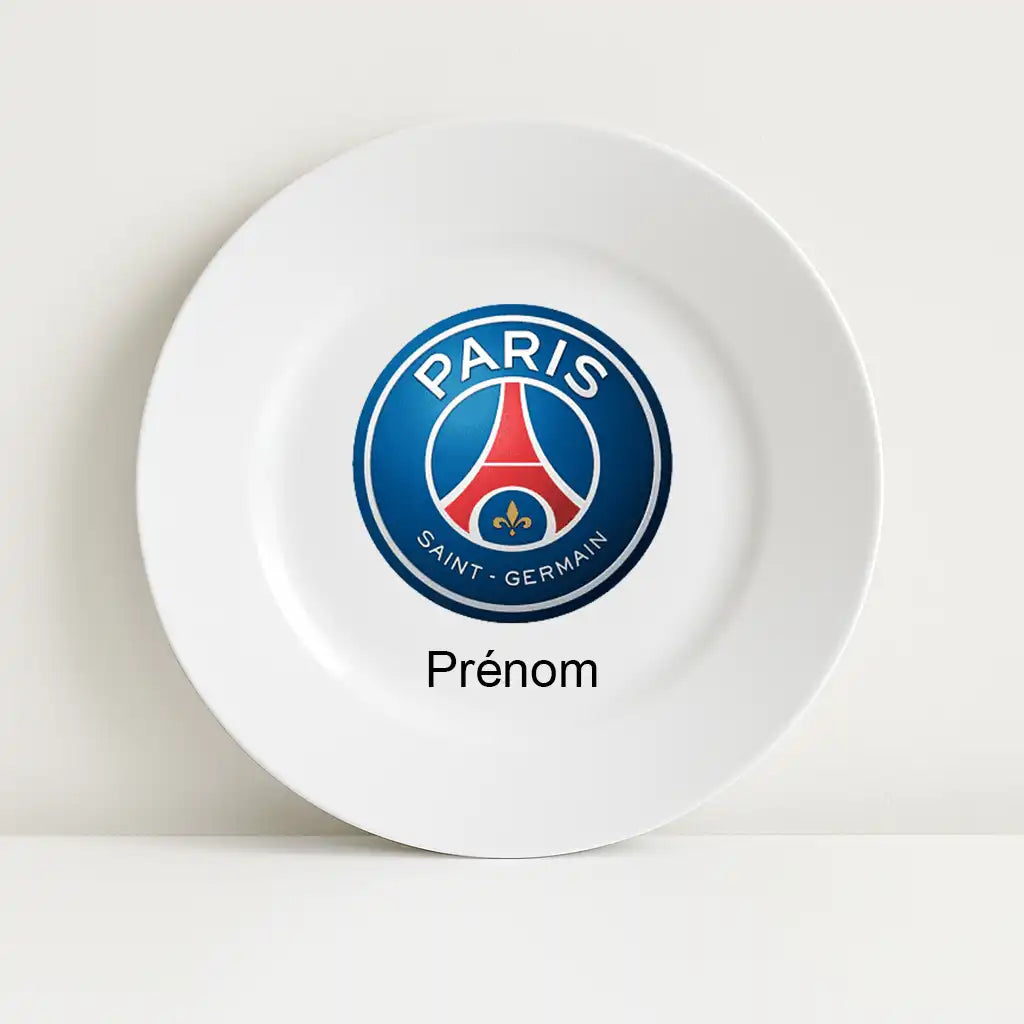 Assiette blanche avec le logo du club de football PSG au centre, surmontant l’inscription personnalisable "Prénom".