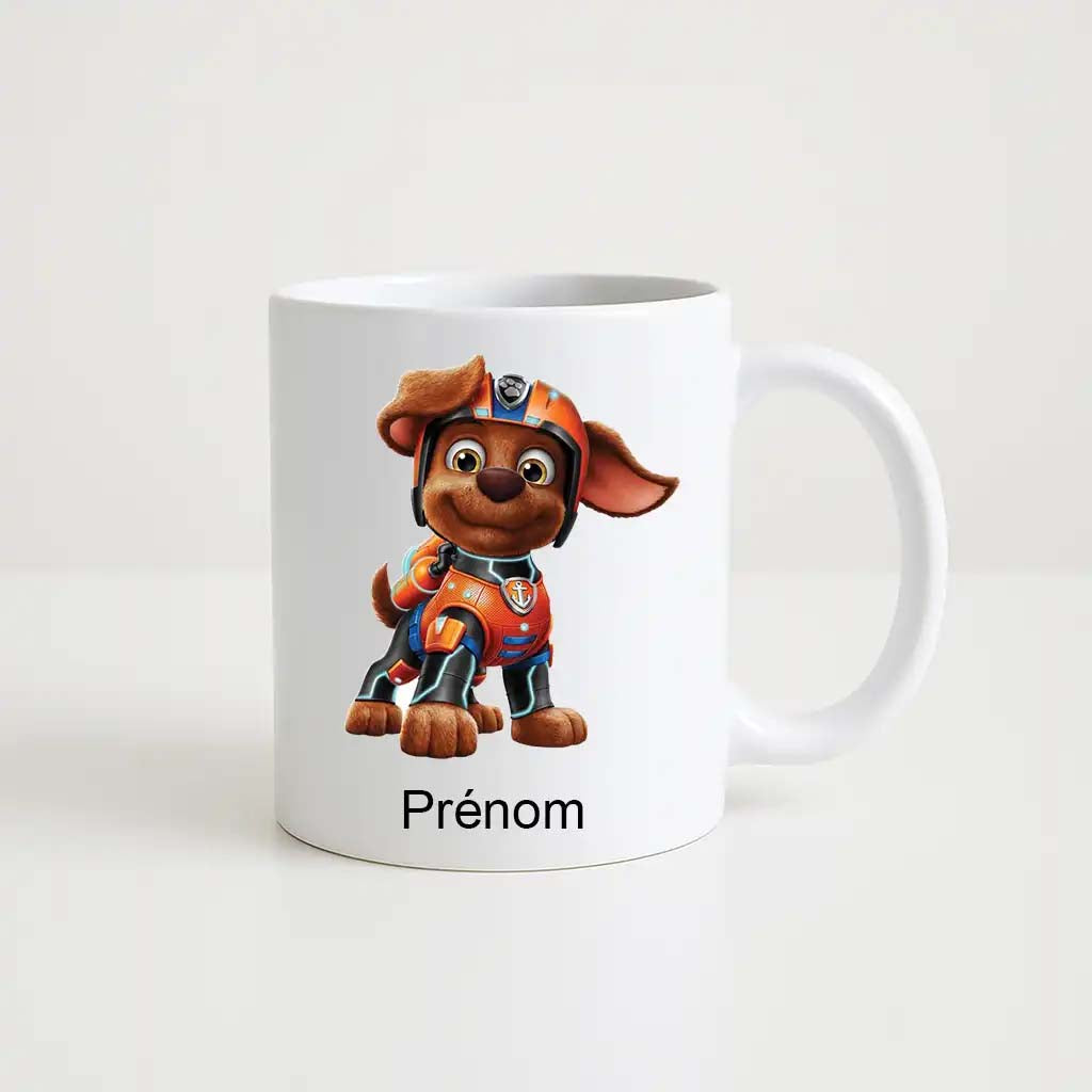 Mug blanc en céramique avec illustration de Zuma, le chiot en combinaison orange de la Pat’ Patrouille, et espace personnalisable pour prénom
