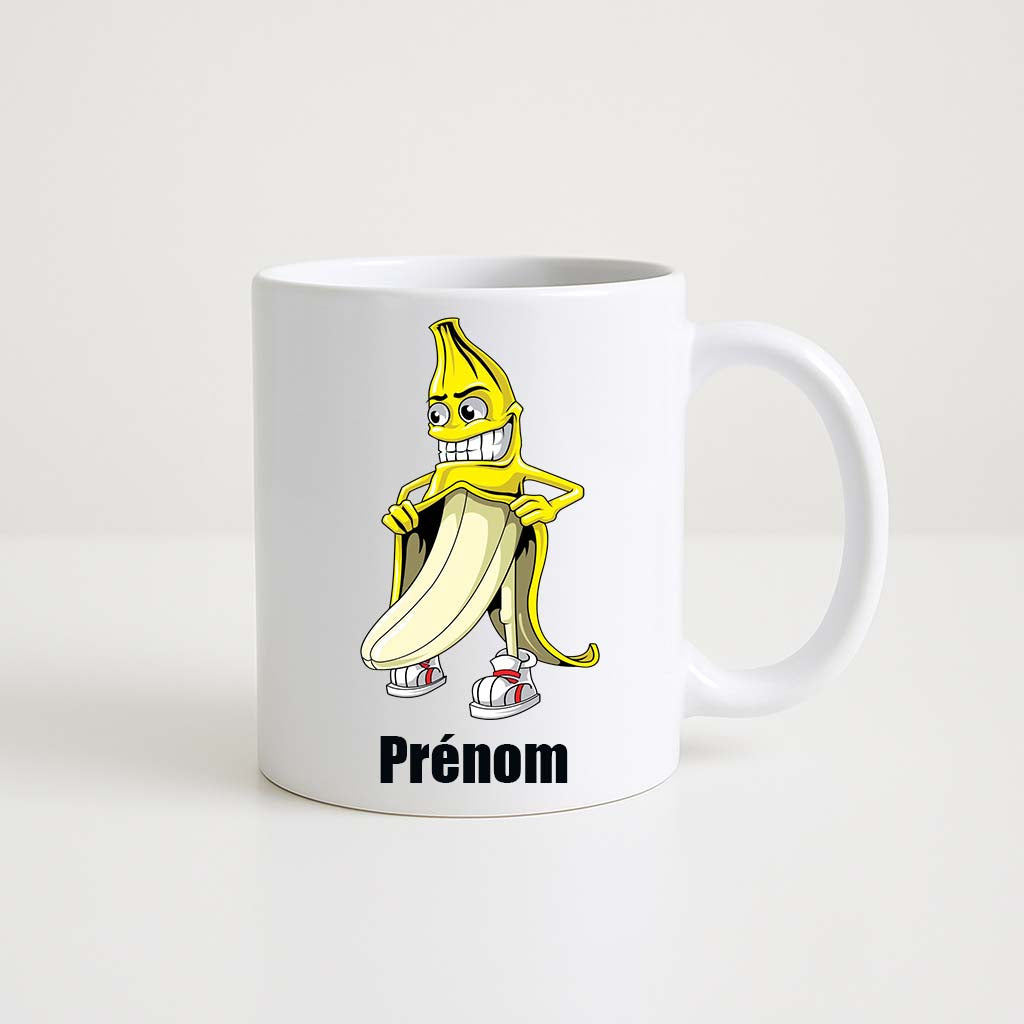 Tasse blanche 330 ml avec illustration humoristique d’une banane cartoon souriante, personnalisable avec prénom, idée cadeau drôle et originale.