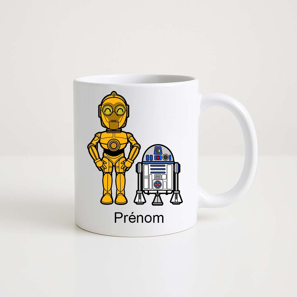 Mug blanc 330 ml avec illustration de deux robots rappelant l’univers Star Wars et un espace personnalisable pour prénom